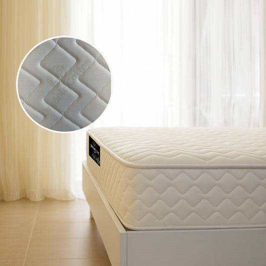 Brooklyn Luxe mattress corner view with wave-quilted fabric on white bed frame - buy in Winnipeg