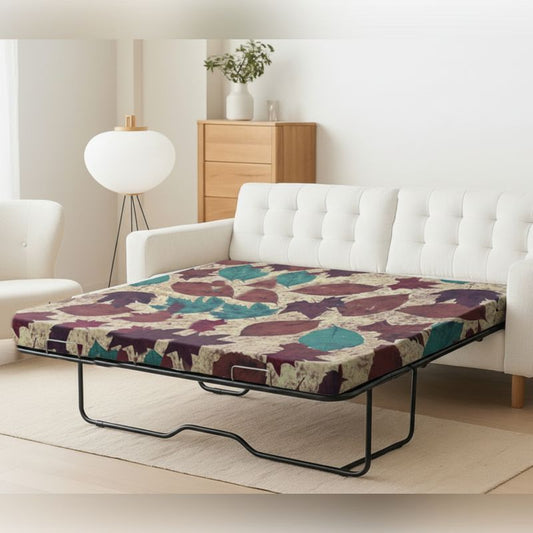 Foldable sofa bed mattress with abstract print, set up in a living room – SleepWell