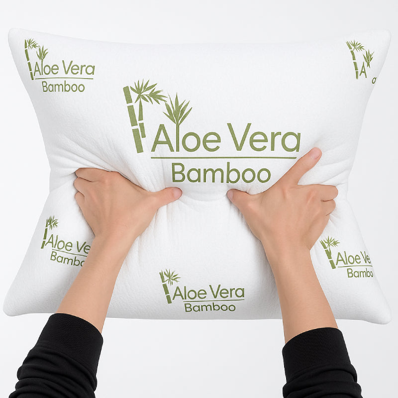 SleepWell Aloe Vera Bamboo pillow being fluffed by hand