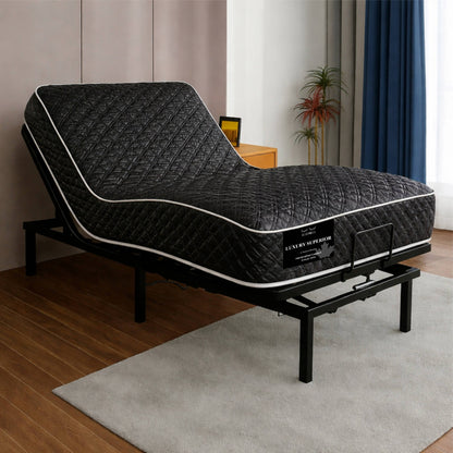 "Luxury Superior mattress in dark quilted diamond-stitch fabric on an adjustable bed base, shown in a full bedroom setting — Sleepwell Bedding."
