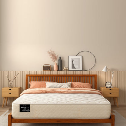 Brooklyn Luxe Medium Firm mattress in a warm mid-century bedroom setting