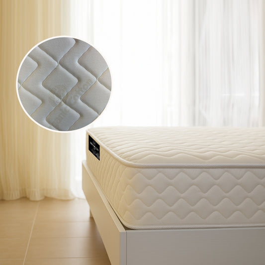 Brooklyn Standard mattress corner view with wave-quilted fabric on white bed frame - buy in Winnipeg