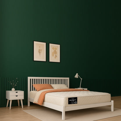 Brooklyn Standard mattress on white bed frame in bold green bedroom - buy in Winnipeg