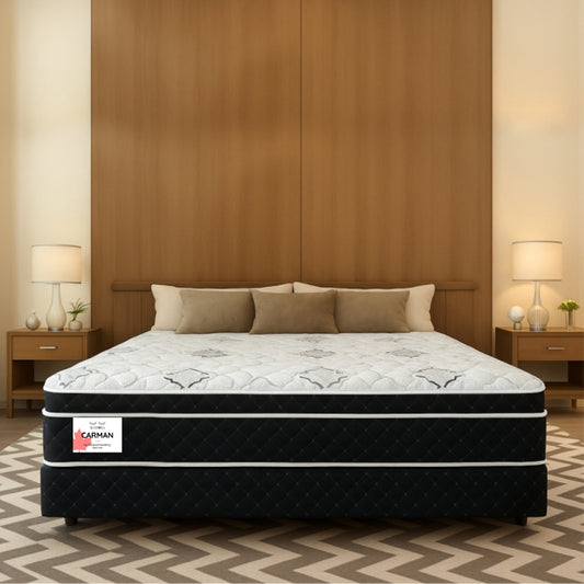 Carman mattress front view in wooden panel bedroom with chevron rug