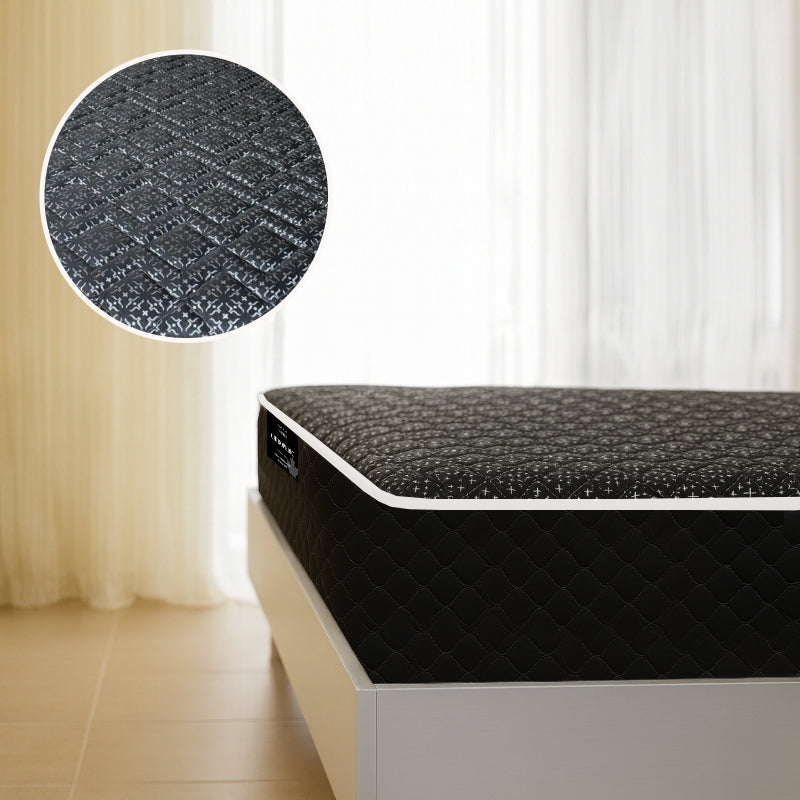 Chiropedic mattress side angle view with black quilted cover in bright bedroom - buy in Winnipeg