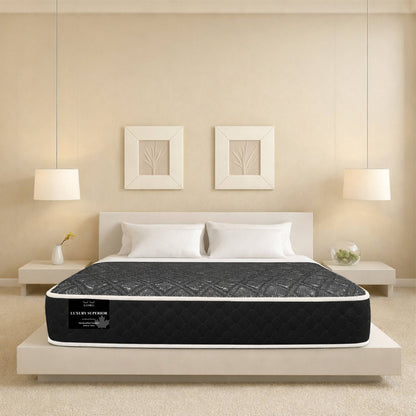 "Luxury Superior mattress in a warm beige bedroom setting with symmetrical nightstands and framed art — Sleepwell Bedding's affordable mattress line."