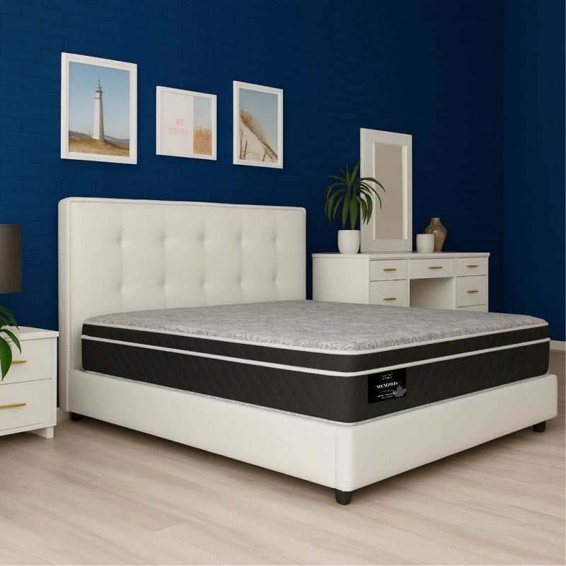 Memphis mattress on white tufted bed frame in navy blue bedroom