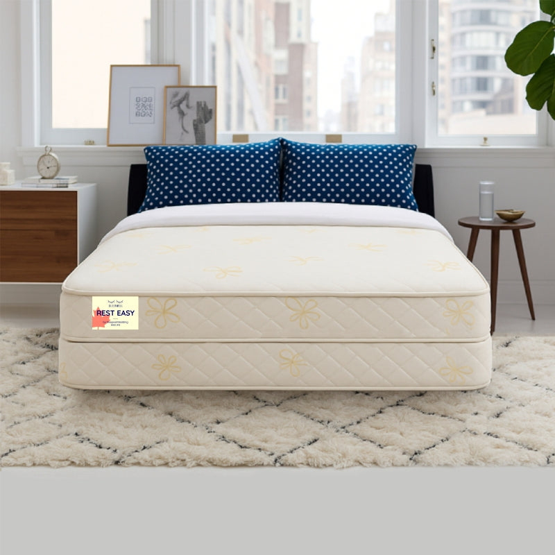 Rest Easy mattress with box spring in bright city-view bedroom