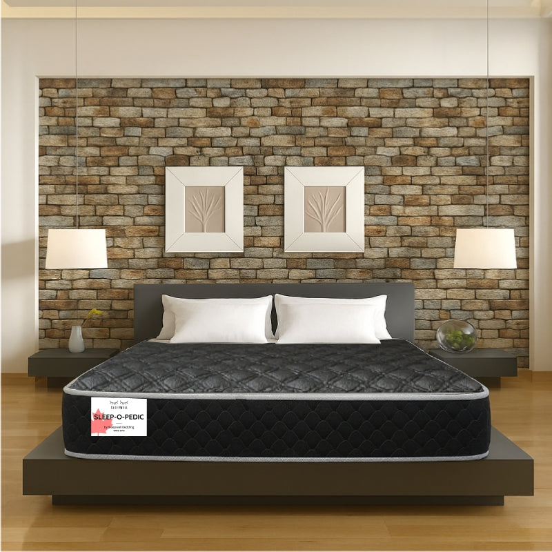 Sleep-O-Pedic mattress front view in modern bedroom with stone accent wall - buy in Winnipeg