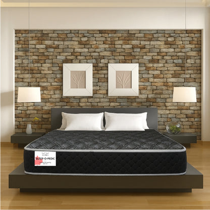 Sleep-O-Pedic mattress front view in modern bedroom with stone accent wall - buy in Winnipeg
