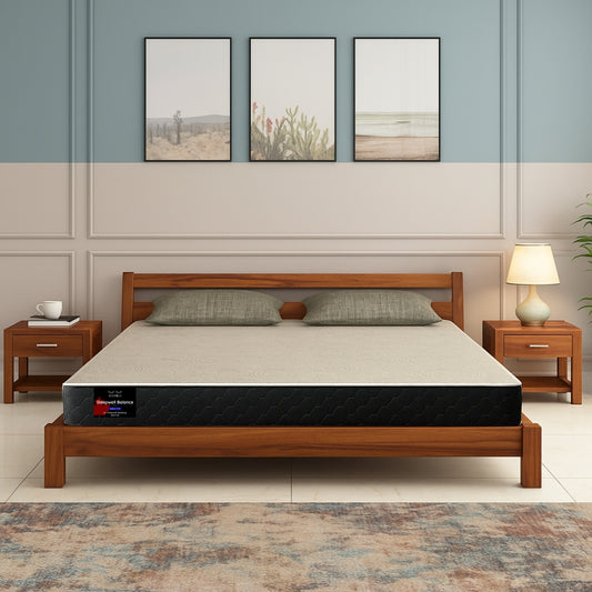 Sleepwell Balance medium firm mattress on wooden bed frame in sage green bedroom