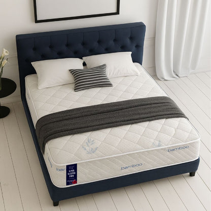 SleepWell Super Sleeper Firm bamboo mattress on navy tufted bed frame