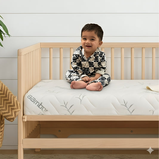 Bamboo crib mattress fitted inside a full-size baby crib