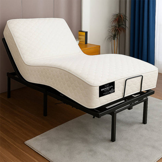 "Brooklyn Standard mattress on an adjustable bed base in lounge position, shown in a bedroom setting — Sleepwell Bedding."