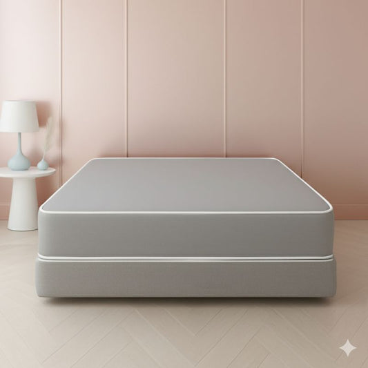 Grey mattress and box spring set in a pink paneled bedroom – SleepWell
