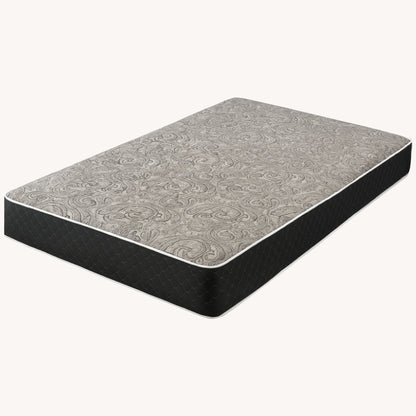 Mattress product shot showing grey swirl pattern fabric on white background