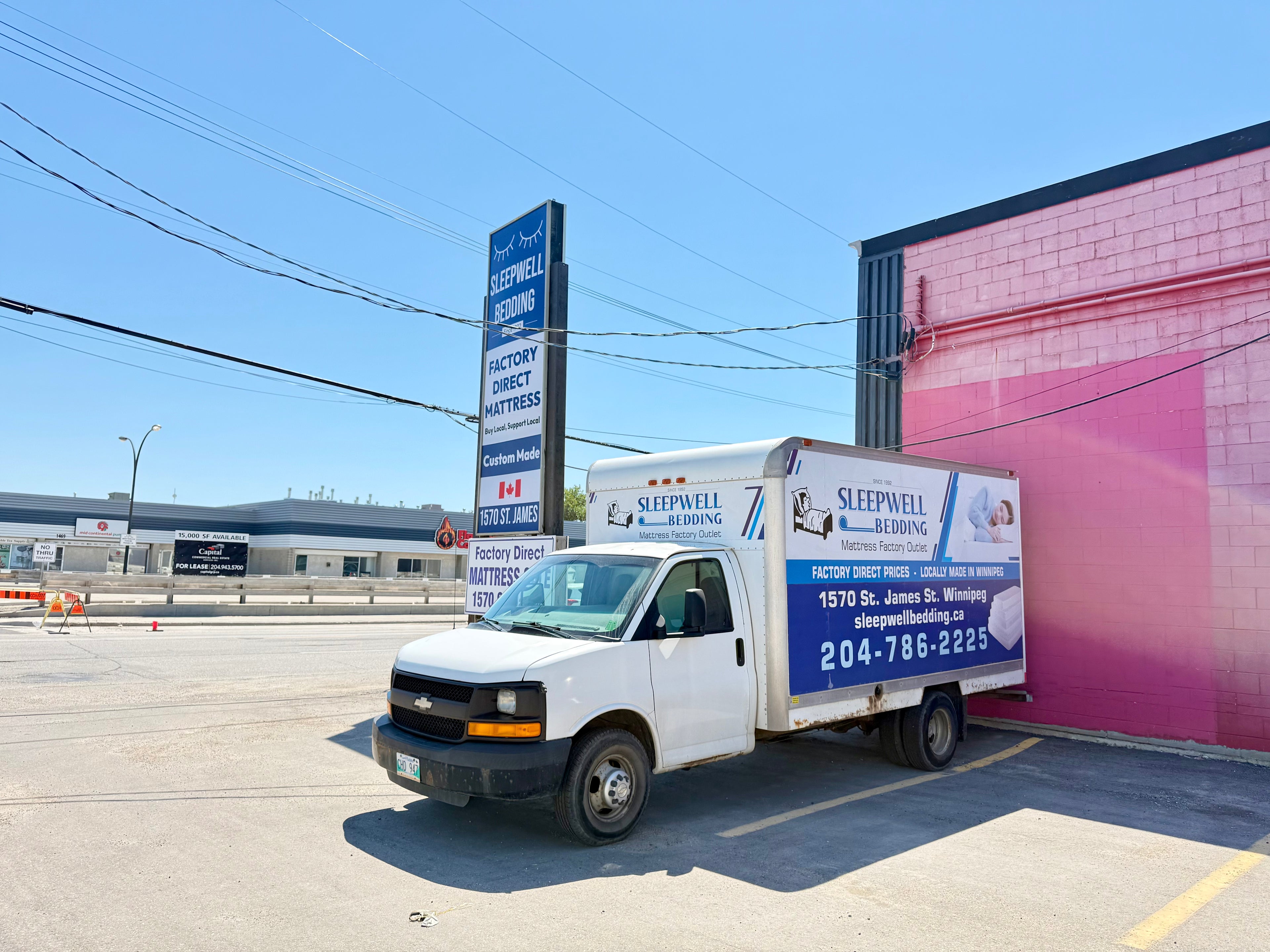 "Sleepwell Bedding factory-direct mattress store and delivery truck at 1570 St. James Street, Winnipeg, Manitoba."