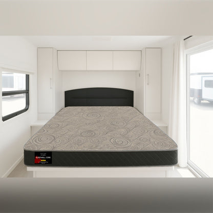 SleepWell Core mattress with quilted swirl pattern, set up in an RV bedroom – SleepWell