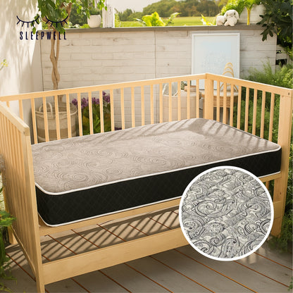 SleepWell crib mattress with fabric texture detail in nursery setting