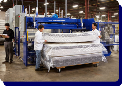 SleepWell factory workers with finished mattress, illustrating factory direct pricing