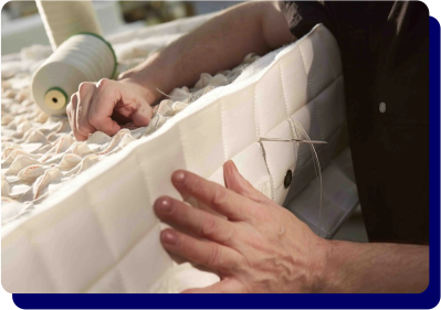 SleepWell mattress being hand-stitched with care during manufacturing