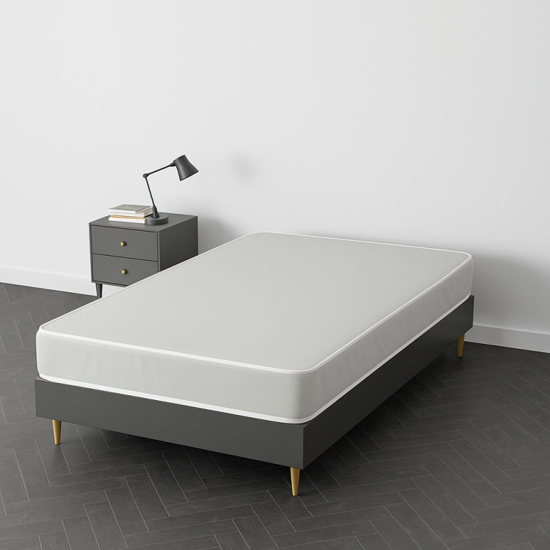 White mattress on a dark grey upholstered bed frame with wooden legs – SleepWell