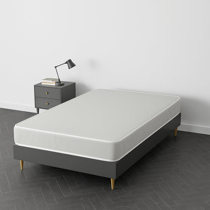 White mattress on a dark grey upholstered bed frame with wooden legs – SleepWell